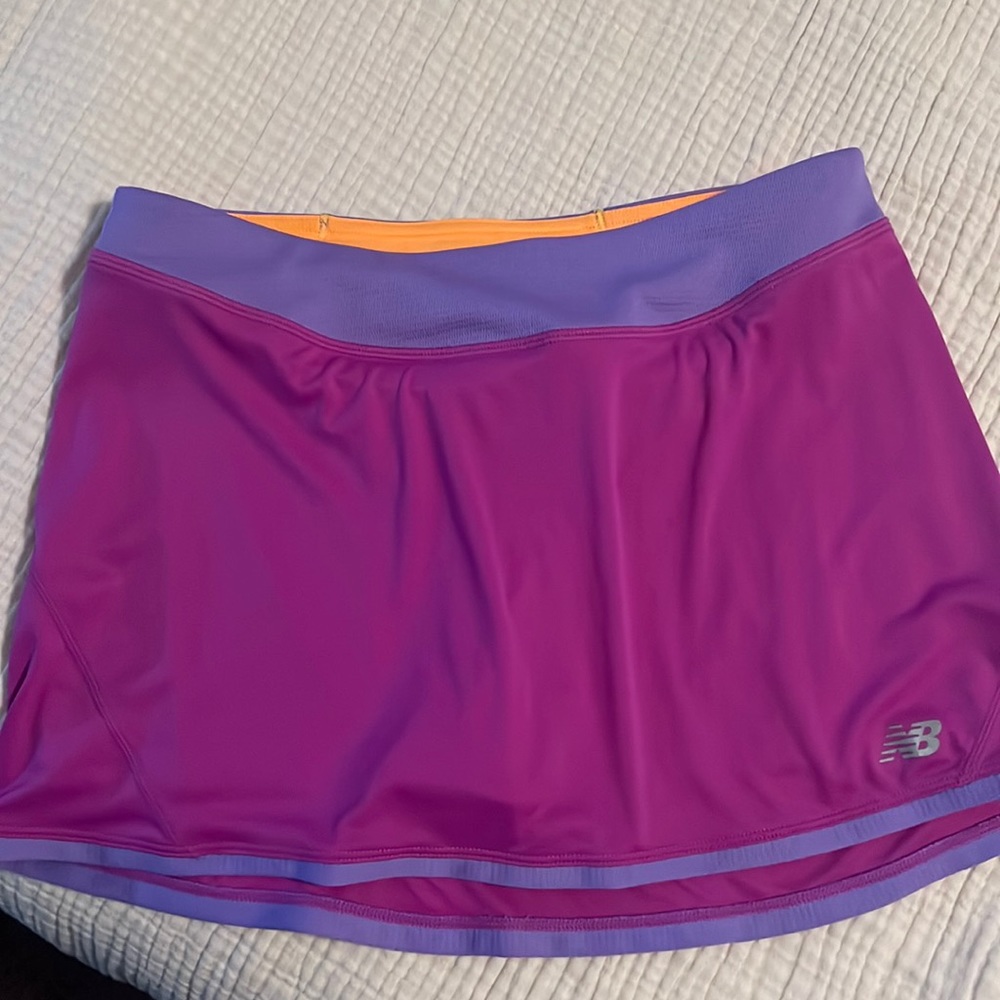 New balance purple and magenta skirt with orange shorts under